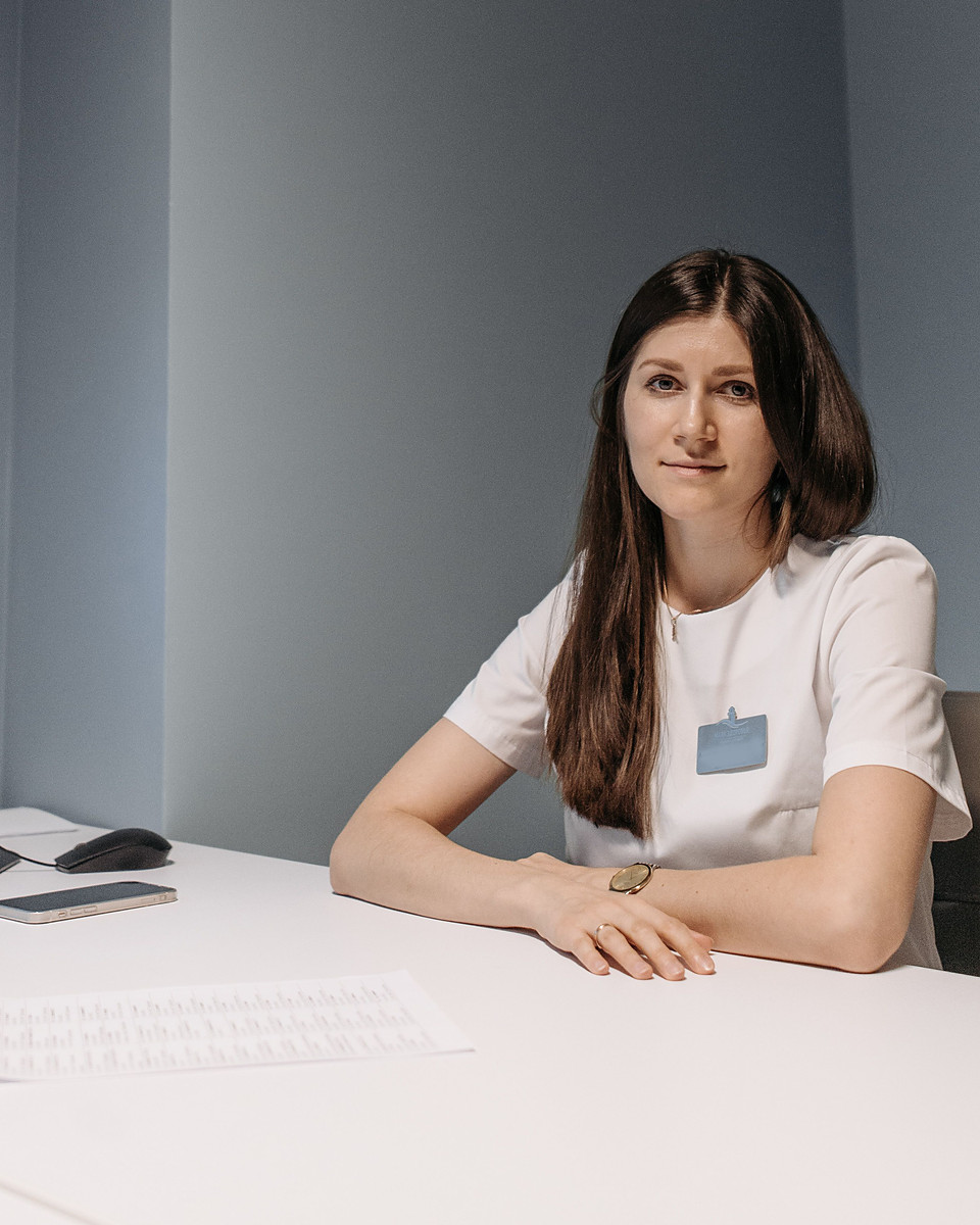 Professional team member at a desk, representing the Oea Healthcare clinical support team